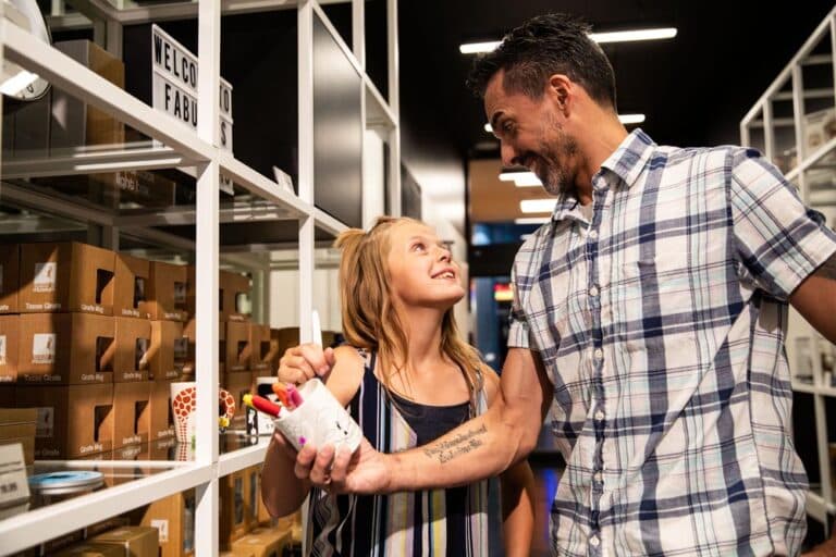 Man and a child inside the boutique at Las Vegas Paradox Museum.