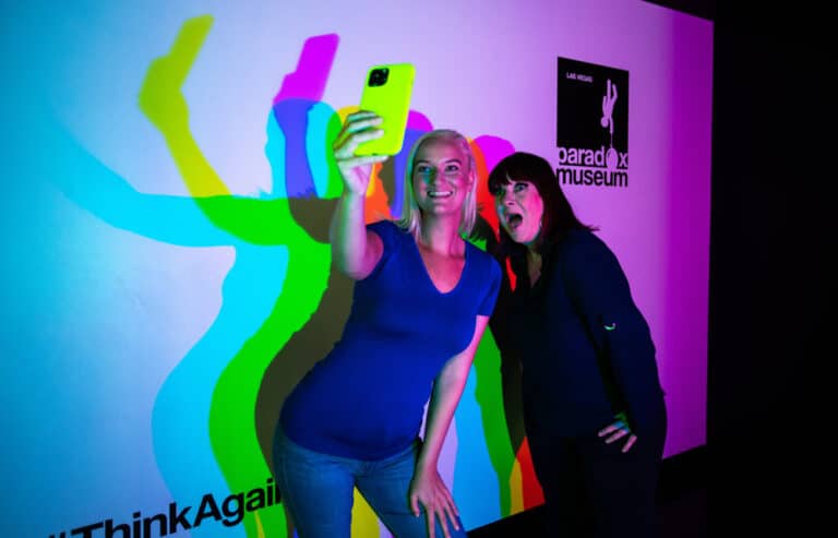 Two women taking selfie at Las Vegas Paradox Museum.