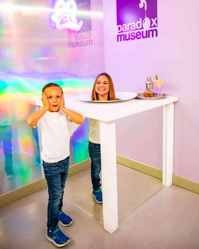 A family experiencing a Paradox exhibit together.